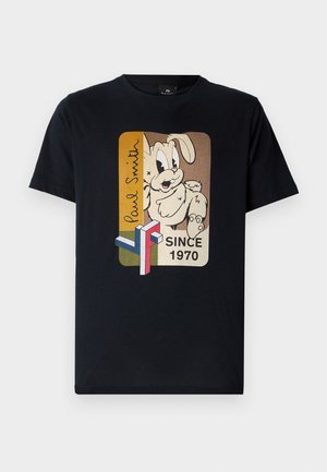 T-shirt noire avec un graphique de lapin en cartoon, des accents multicolores, et le texte "Paul Smith" au-dessus d'une étiquette "Depuis 1970". En coton doux.