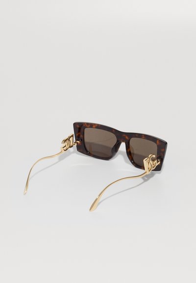Tortoiseshell rectangular sunglasses with dark lenses and gold temples featuring intertwined logo accents on a white background.