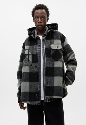 WITH A DETACHABLE HOOD - Light jacket - black