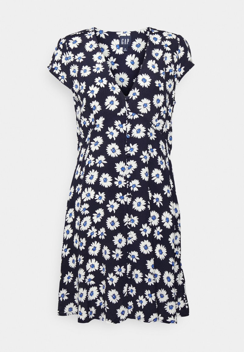 Robe bleu marine à manches courtes avec un imprimé marguerite blanc et bleu, décolleté en V, boutons sur le devant et taille cintrée.