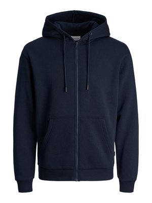 Mornarska zip-up perika izrađena od meke mješavine pamuka. Ima kapuljaču s vezicom, dva prednja džepa, rebraste manžetne i glatku teksturu.