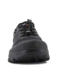 Black athletic shoe with a smooth upper, textured side, and thick rubber sole. Features elastic laces and a toggle closure for fit adjustment.