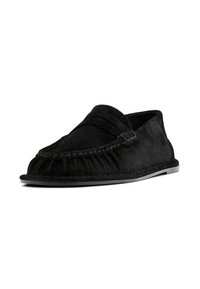 Black suede moccasin-style shoe with a rounded toe, raised stitching, and a frayed edge detail. Flat sole, minimalist design.