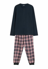 Granatowa bluzka z długim rękawem i trzema guzikami przy kołnierzu, zestawiona z czerwono-biało-niebieskimi spodniami w kratę z elastycznymi mankietami. Materiał z mieszanki bawełny.