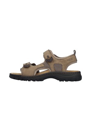 Sandale beige d'extérieur à bout ouvert avec des brides ajustables, des panneaux en mesh et une semelle noire matelassée, conçue pour le confort et le soutien.