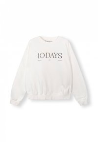 Sudadera blanca con cuello redondo, mangas largas y puños acanalados. Presenta texto impreso en negro "10 DAYS" en la parte delantera. Material suave.