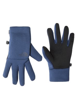 Blue gloves featuring a smooth fabric exterior with textured black palm and fingers for grip. Includes logo detail and adjustable wrist.