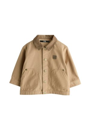 Tan button-up jacket with a brown collar, two front pockets, and a small logo patch. Made of sturdy cotton fabric. Features a relaxed fit.