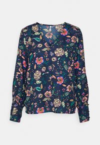 Blusa floreale blu navy con scollatura a V, maniche lunghe e polsini arricciati. Presenta vivaci motivi floreali e foglie su un tessuto liscio.