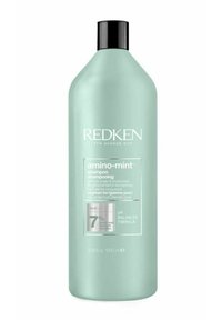Redken amino-mint shampoo in een hoge, muntgroene plastic fles met een zwarte dop. Het etiket toont productdetails en de pH-gebalanceerde formule.