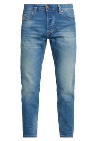Ljusblå denimjeans med slim fit, med en urtvättad look, fem fickor, en knappstängning och minimal slitage på tyget.