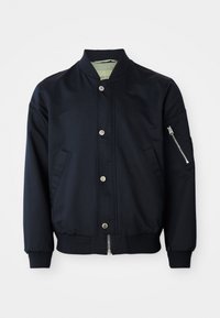 Navy bomber jacket with snap buttons, zippered arm pocket, ribbed collar, cuffs, and hem, front side pockets on white background.