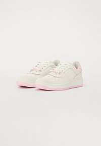 White and pastel pink sneakers with suede and leather materials, featuring perforated design, flat laces, and textured rubber soles.