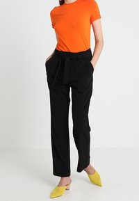 KIOMI Tygbyxor - black