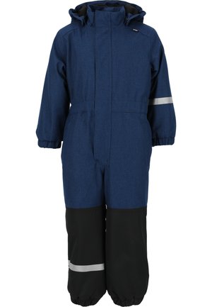 Salopette bleu marine avec une finition texturée, partie inférieure noire, poignets élastiques et détails réfléchissants. Comprend une capuche et un zip avant.