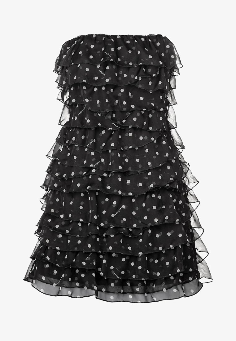 Robe noire sans bretelles à pois blancs, avec un tissu à volants superposés sur toute la longueur.