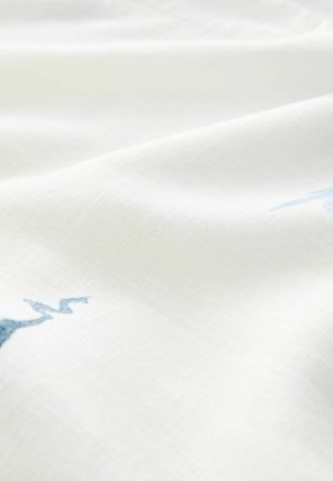 White fabric with a soft texture, featuring light blue embroidered patterns. The material appears smooth with a subtle weave detail.