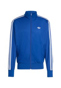 Modrá síťovaná sportovní bunda s bílými třemi pruhy na rukávech, vysokým límcem, celým zipem a malým bílým logem na hrudi.