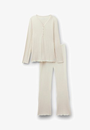 Kremowy, prążkowany top z długim rękawem z guzikami oraz dopasowane, szerokie spodnie w prążki, ułożone płasko na białym tle.