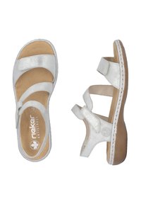 White leather sandals featuring a metallic finish, three adjustable straps, a cushioned footbed, and a stitched sole design.