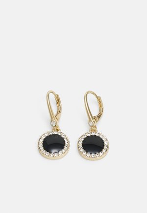 Gold hoop earrings featuring a large black circular centerpiece surrounded by a ring of small clear crystals. Elegant design with shiny finish.