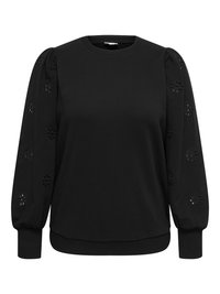 Melns džemperis ar apaļu kakla izgriezumu un uzpūstām piedurknēm ar ziedu izgriezumu detaļām. Ribbota aproces un jostasvieta rada pieguļošu izskatu.