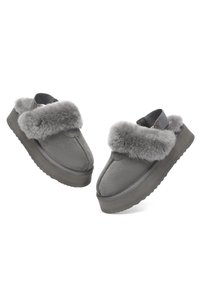 Grey slip-on shoes with a fluffy fur trim, suede upper, platform sole, rounded toe, and contrasting texture details.