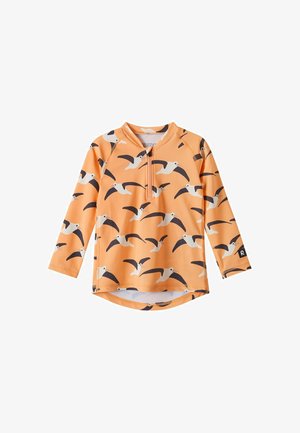Langärmliges oranges Kinderhemd mit schwarz-weißem Muster fliegender Vögel und vorderem Reißverschlusskragen.