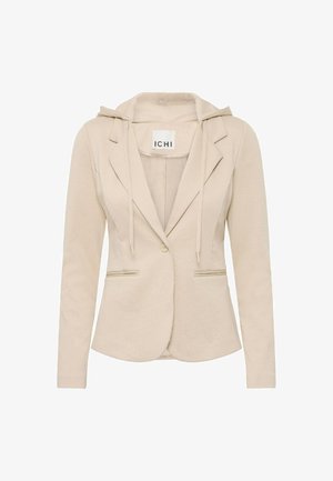 Veste blazer beige avec capuche, épaules structurées, deux poches avant, fermeture à bouton et tissu texturé. Étiquette visible à l'intérieur du col.