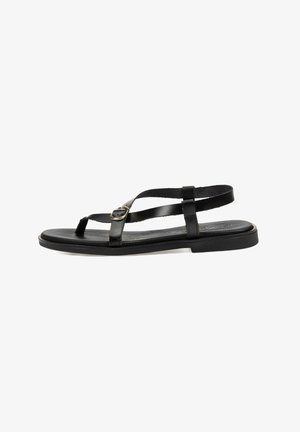 Sandaleta plana negra con tiras finas y hebilla ajustable, diseñada para un uso casual con un estilo minimalista.