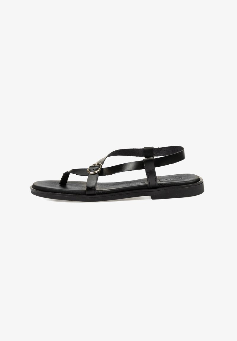 Sandaleta plana negra con tiras finas y hebilla ajustable, diseñada para un uso casual con un estilo minimalista.