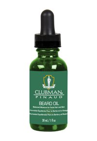 Grön glasflaska med ett svart dropparlock, märkt "Clubman Pinaud Beard Oil", med vit text och en logotyp. Innehåller 30 mL.
