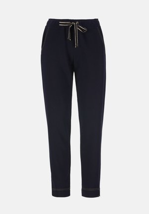 Pantalon de survêtement bleu marine à coupe fuselée avec taille élastique, cordon rayé, poches latérales et surpiqûres visibles aux poignets et aux coutures.