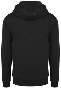 Schwarzer Kapuzenpullover mit großzügiger Kapuze, langen Ärmeln sowie gerippten Bündchen und Saum. Hergestellt aus einem weichen, strukturierten Stoff.