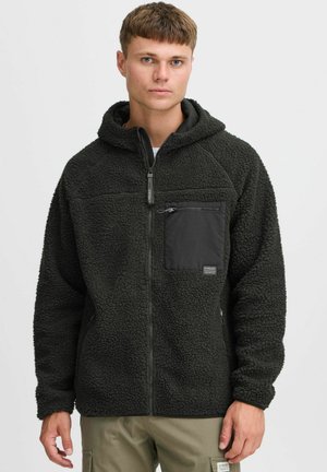 Black fleece hoodie with a zippered chest pocket, textured surface, and adjustable hood. Features raglan sleeves and side pockets.