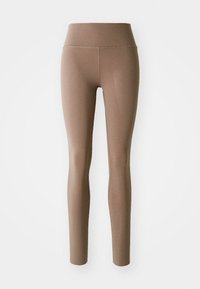 Bruna högmidjade sömlösa leggings med flatlock-söm, designade för en snug passform och ankellängd mot en vit bakgrund.