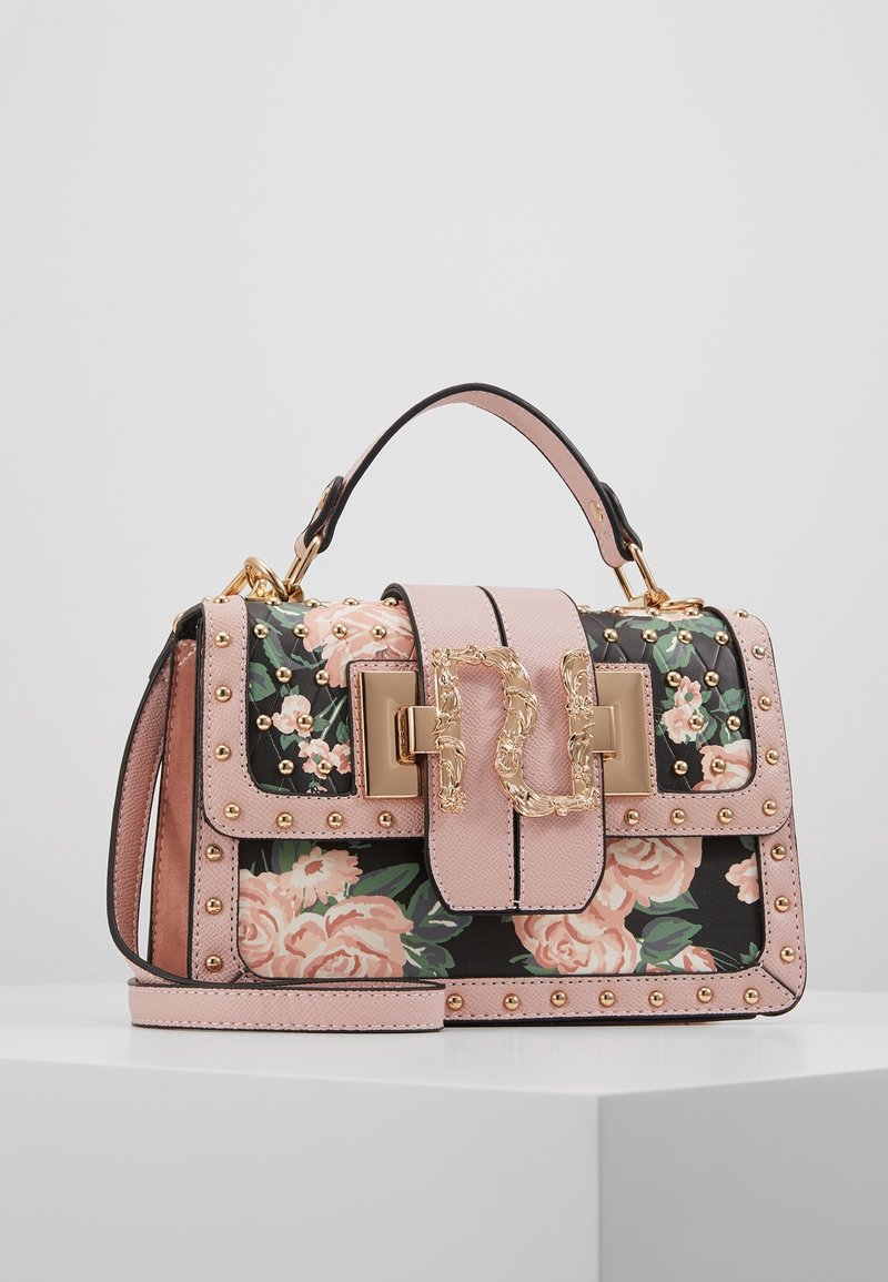 Blommönstrad handväska i svart med rosa accenter, guldstift och ett guldkläpp.