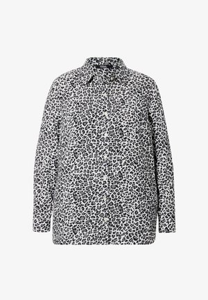 Luipaardprint overhemd met knopen in zwart en wit, lange mouwen, zachte stof, met een kraag en knoopsluiting aan de voorkant.