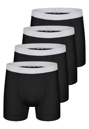 Quatre boxers noirs pour hommes avec de larges ceintures élastiques blanches, empilés en diagonale sur un fond blanc.