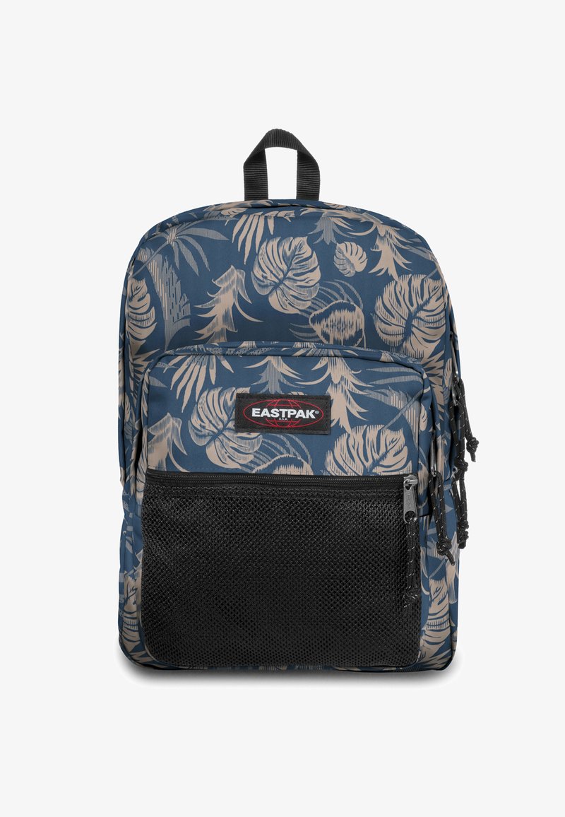 Sac à dos bleu marine avec un motif de feuilles tropicales beige, doté d'une poche avant en filet et d'une poignée de transport supérieure. Design en tissu durable.