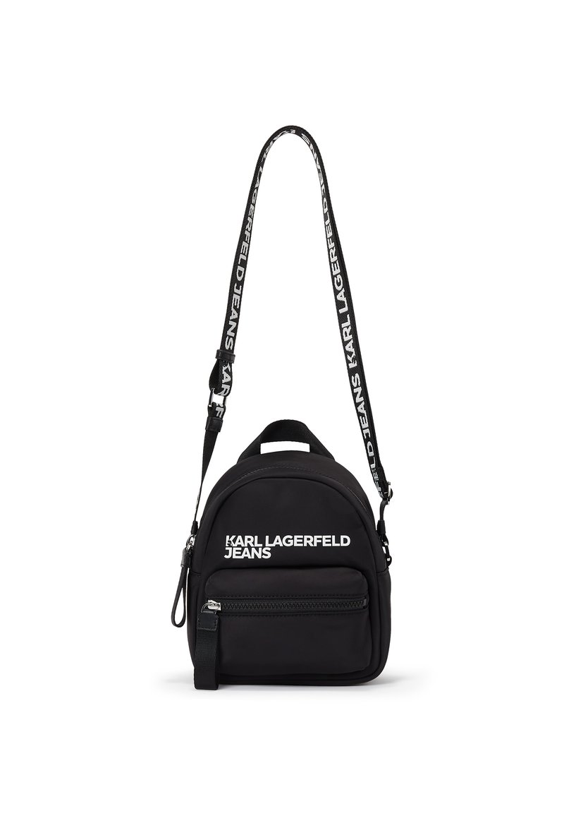 Black mini backpack with front zipper pocket and adjustable shoulder strap featuring "Karl Lagerfeld Jeans" branding in white.