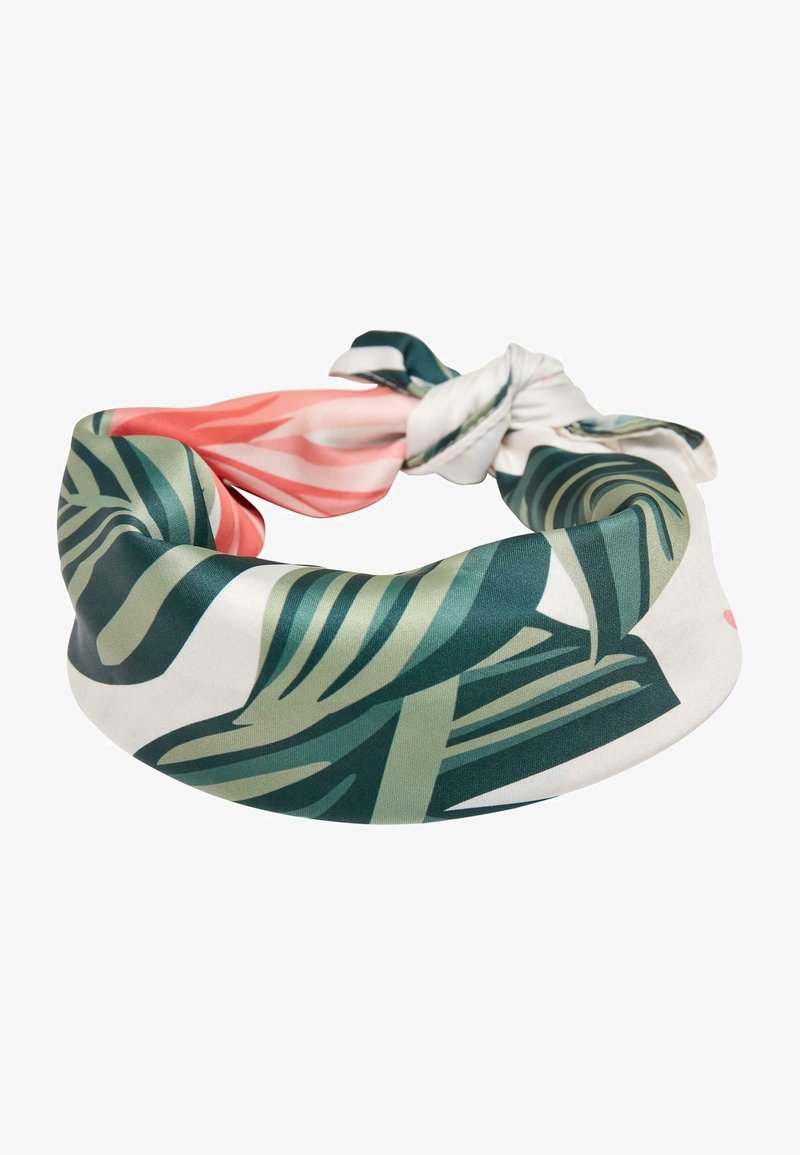Bandeau en soie avec nœud, présentant des motifs abstraits de feuilles tropicales vertes et corail rose sur fond blanc.