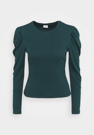 Dark green long-sleeve ribbed top with puffed shoulders and a round neckline, fitted through the waist.