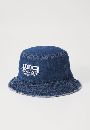 Denim bucket hat with embroidered white logo. Features a round crown and a slightly frayed, wide brim. Dark blue color and textured fabric.