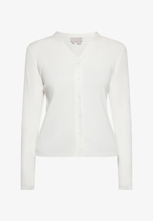 Fehér, bordázott kardigán V-nyakkal, elülső gombokkal és hosszú ujjal. A mélyebb hatás érdekében texturált anyag jellemzi.