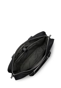 Sac en nylon noir avec une fermeture éclair argentée, présentant un intérieur gris spacieux, des poches de rangement et deux poignées de transport.