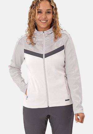 Light grey zip-up jacket with darker grey chevron details, soft texture, stand-up collar, and side pockets. Logo visible on the chest.