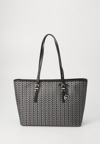 Black and white patterned tote bag with leather straps and silver hardware. Features a geometric design and a logo charm.