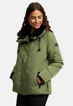 Green puffer jacket with a black faux fur collar, zippered pockets, adjustable drawstrings, and quilted texture. Features logo patch on sleeve.