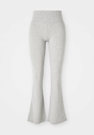 Gray flared leggings made of soft fabric, featuring an elastic waistband and a smooth texture, tapering to a flare at the hem.
